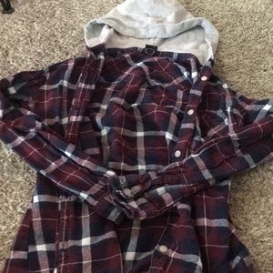 A flannel with a grey hood